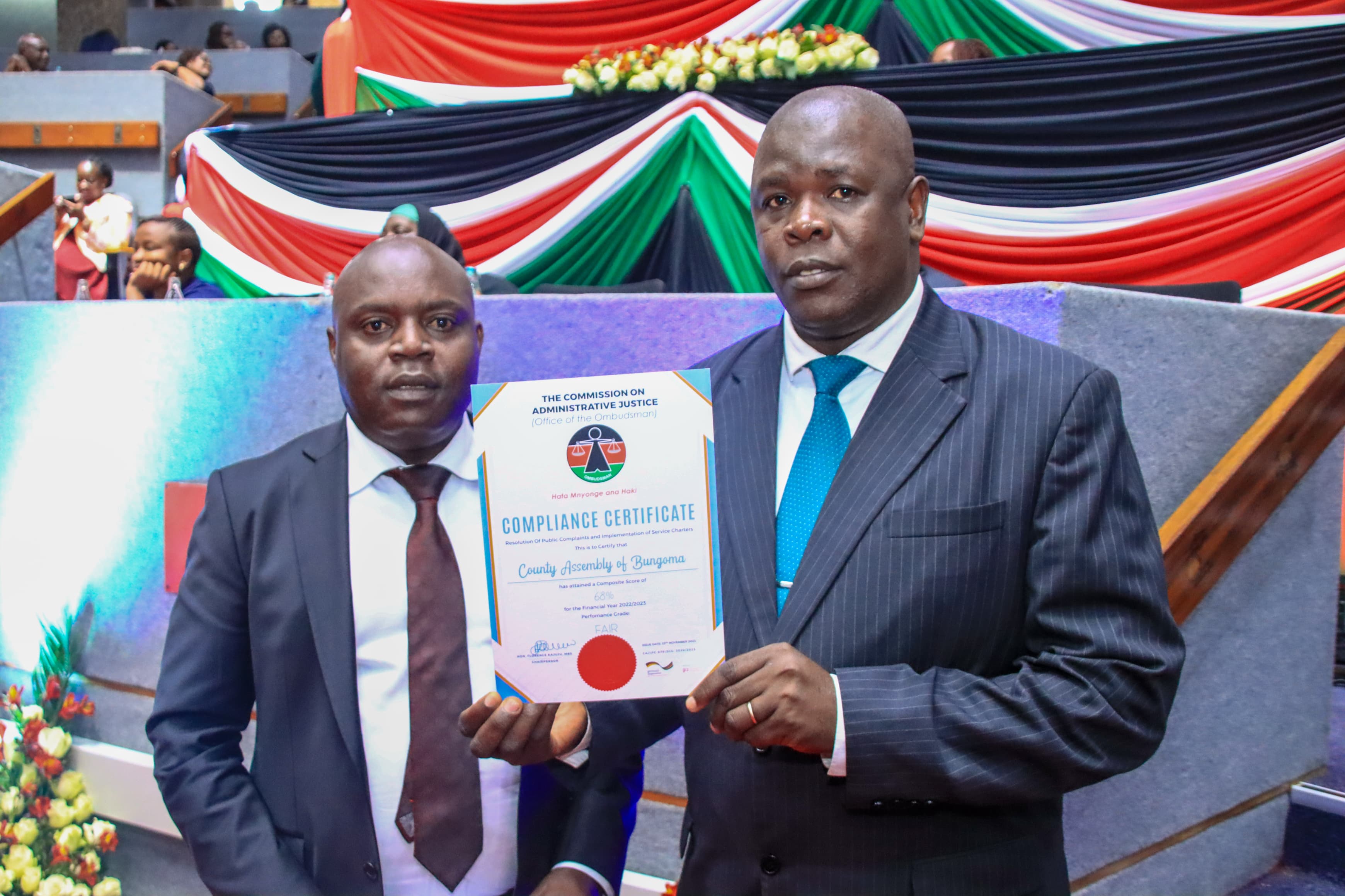 Speaker Hon. Emmanuel Situma and Clerk Mr. Charles W. Wafula display the certificate awarded to the County Assembly of Bungoma for effective handling of complaints and implementation of the service charter